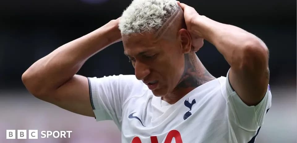 Player holding head in distress on the pitch