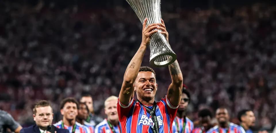 Player celebrating with trophy after match victory