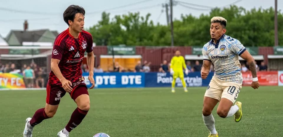 Players competing for the ball in USL match