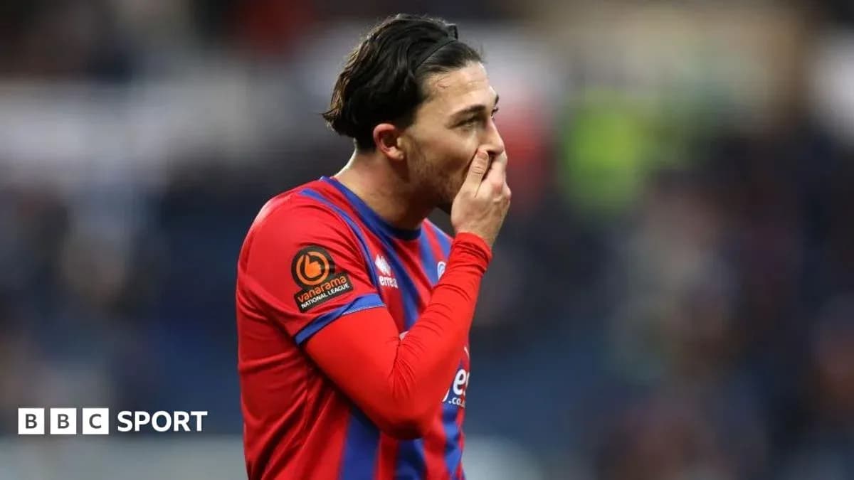 Player in red and blue kit during match