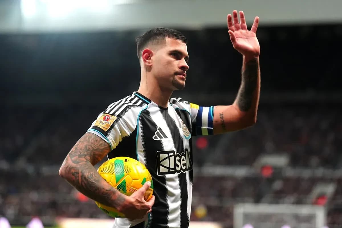 Player waving while holding a football during match