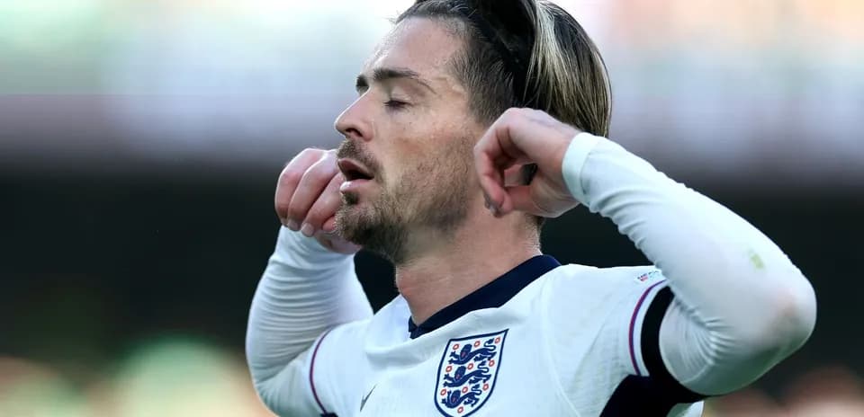 Player in England kit with closed eyes during match