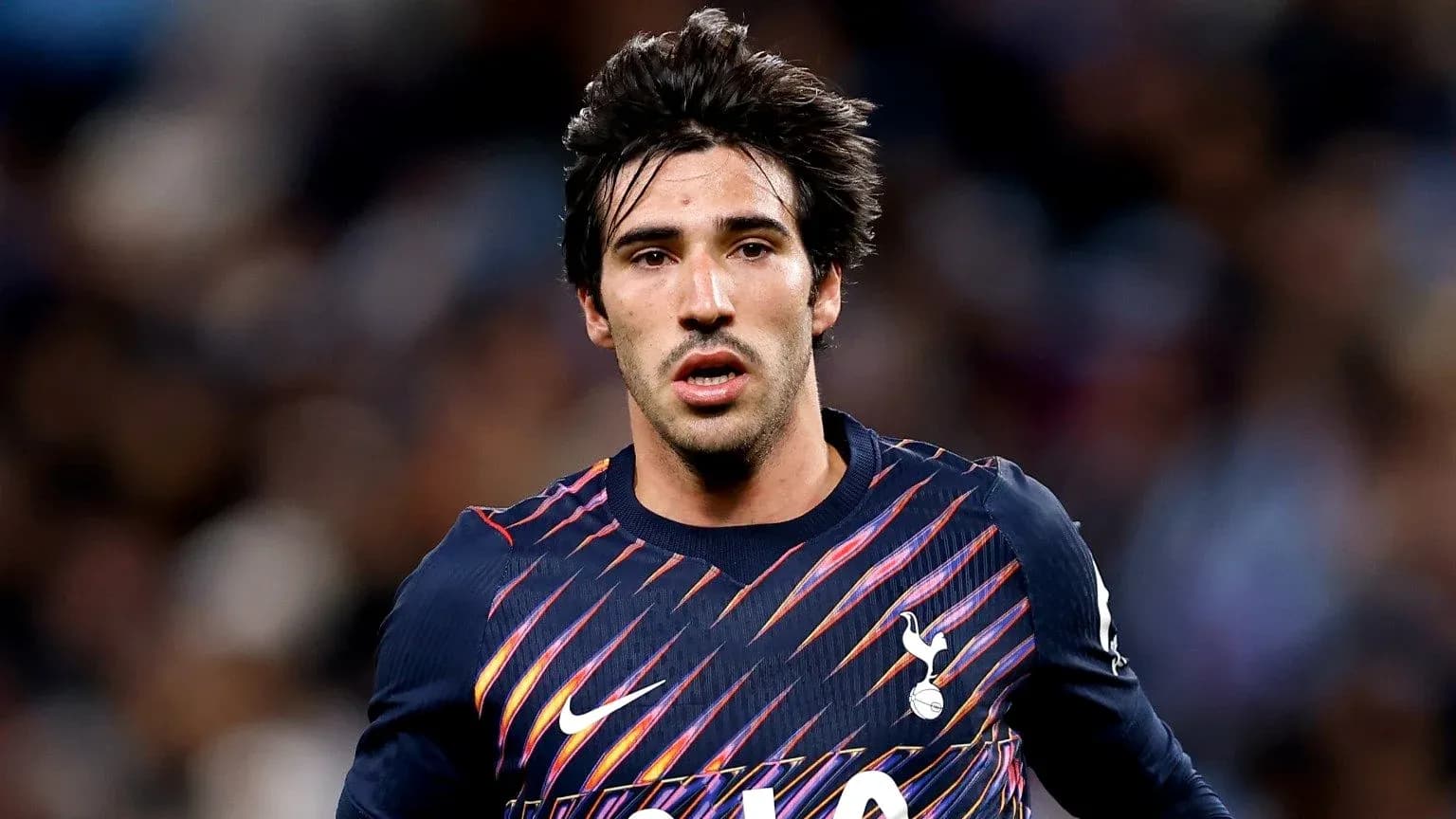 Player in Tottenham jersey during match action