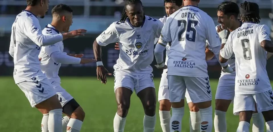 Players celebrating during Monterey Bay match