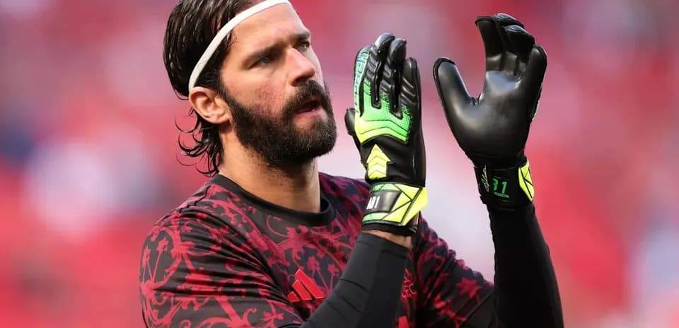 Goalkeeper preparing with gloves before match