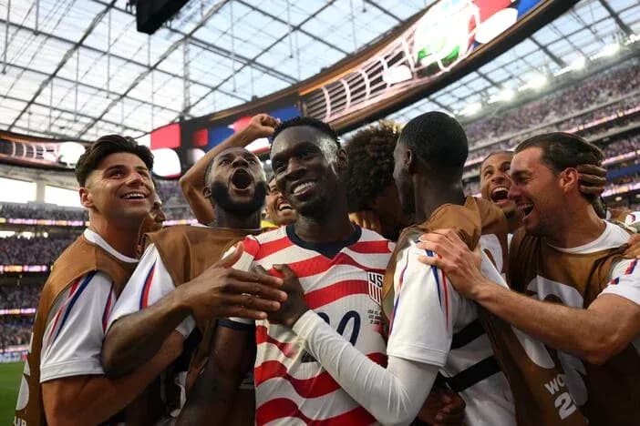 USMNT players celebrating a goal together