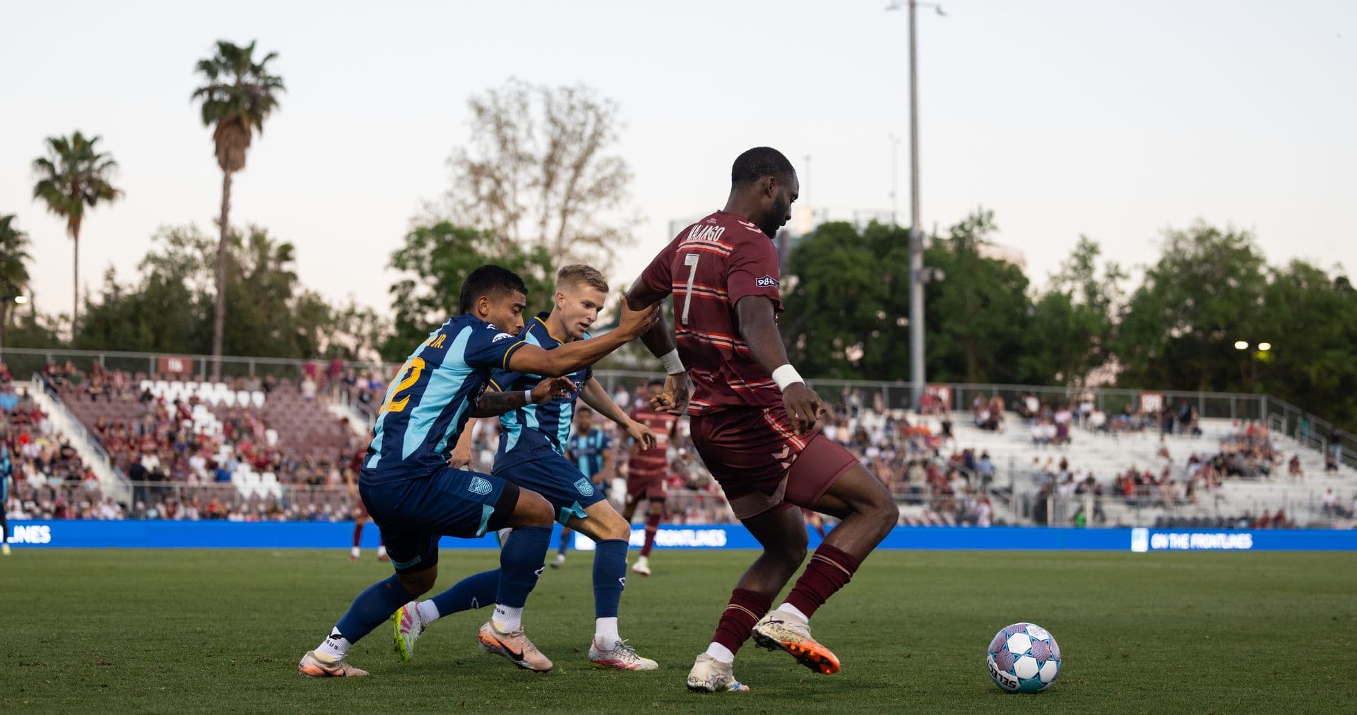 Players competing for the ball in USL match