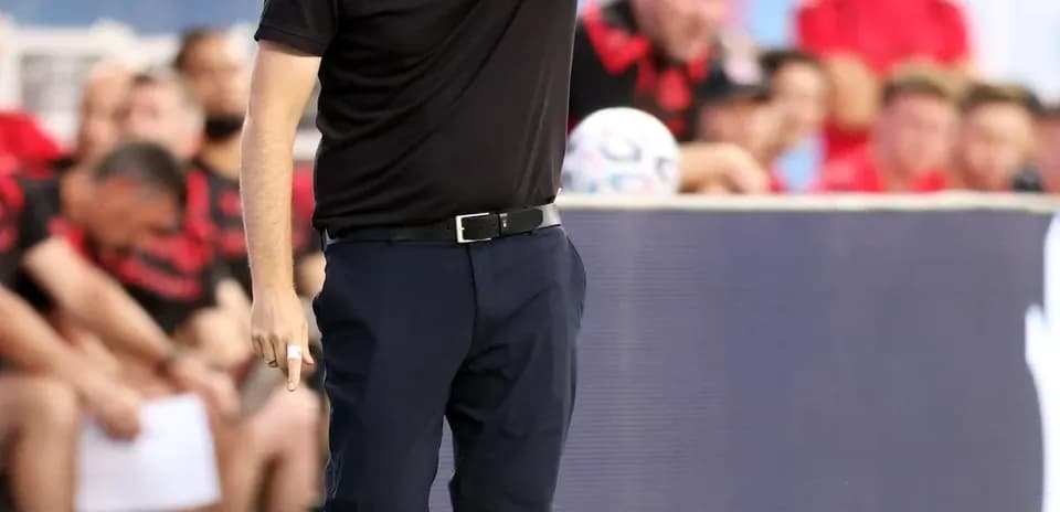 Coach directing players during a match