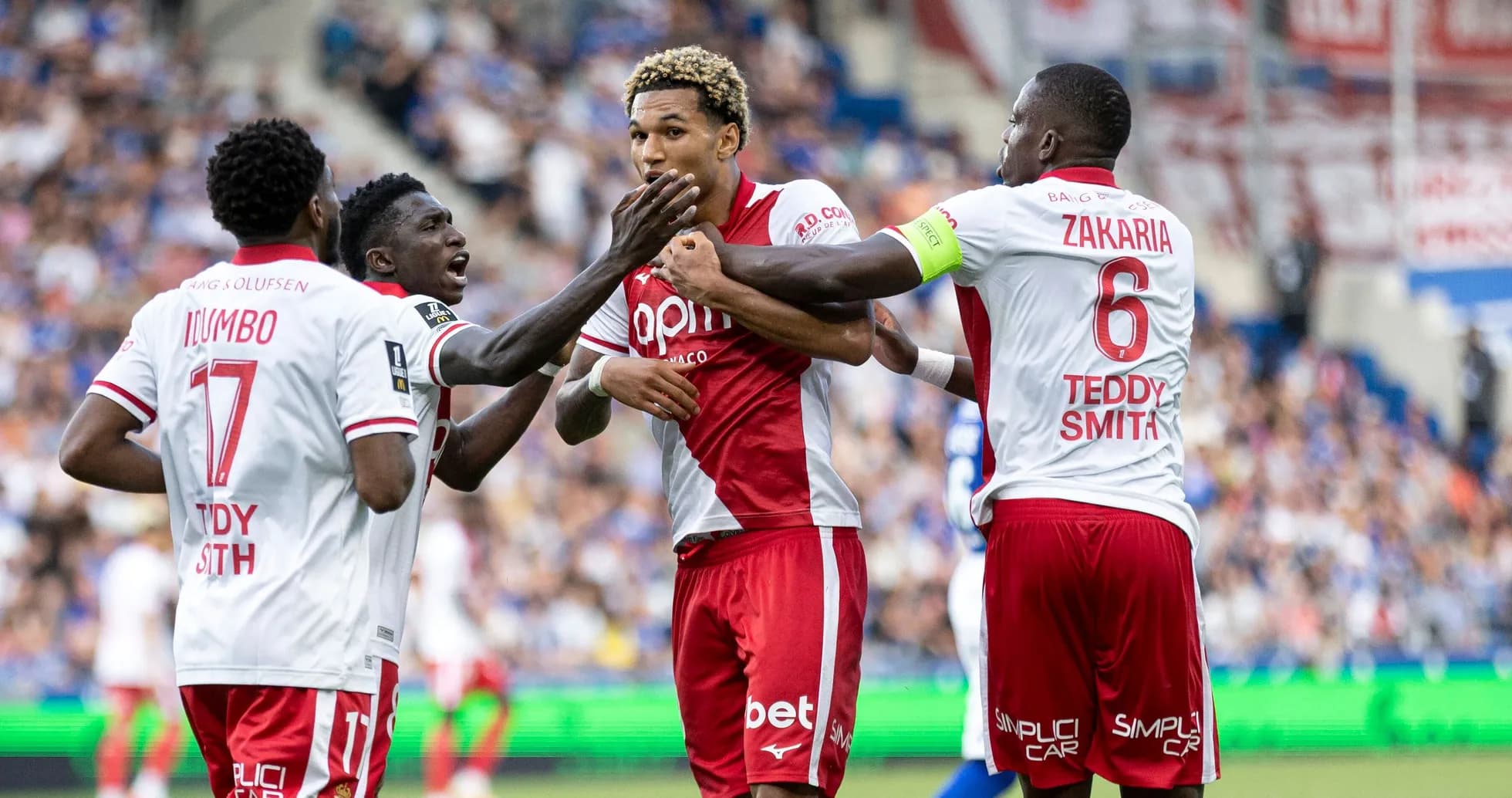 Players celebrating after a goal during match