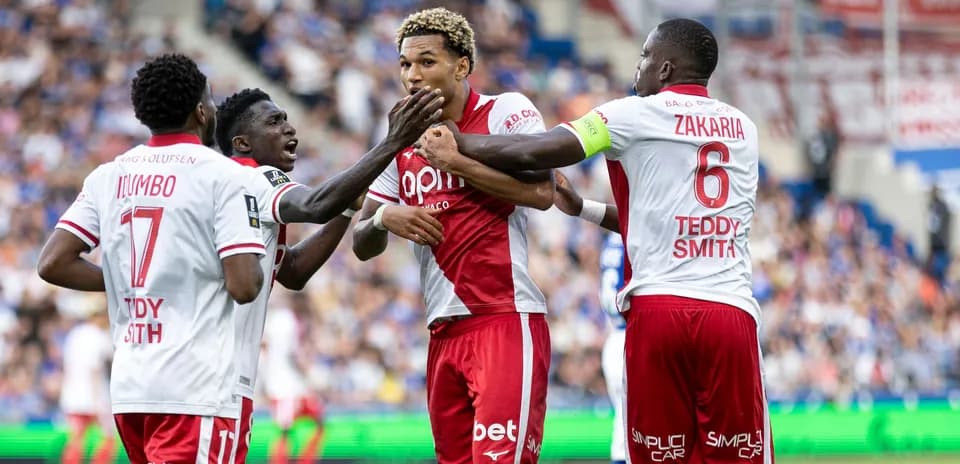Players celebrating after a goal during match