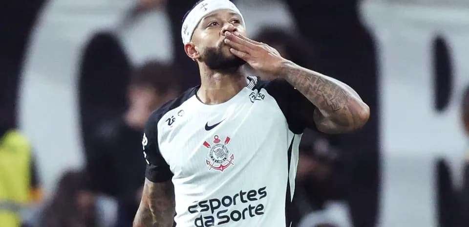 Player celebrating and blowing a kiss after scoring