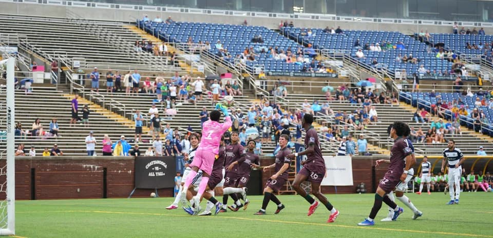 Goalkeeper making a save during MLS Next Pro match