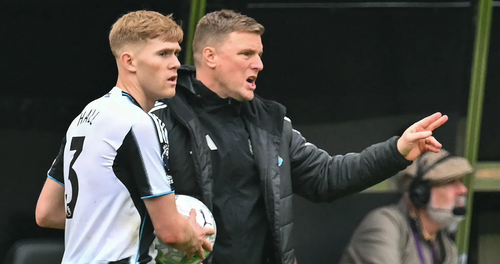 Newcastle United coach instructing player during match