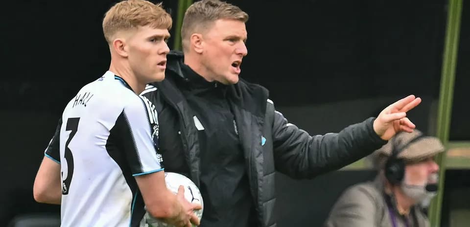 Newcastle United coach instructing player during match