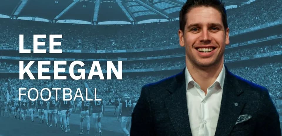 Lee Keegan smiling in front of stadium crowd