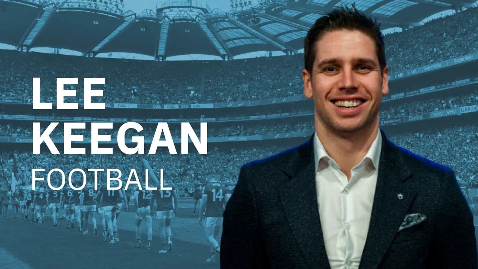 Lee Keegan smiling in front of stadium crowd