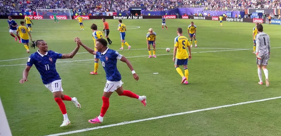 Players celebrating a goal during France vs Sweden