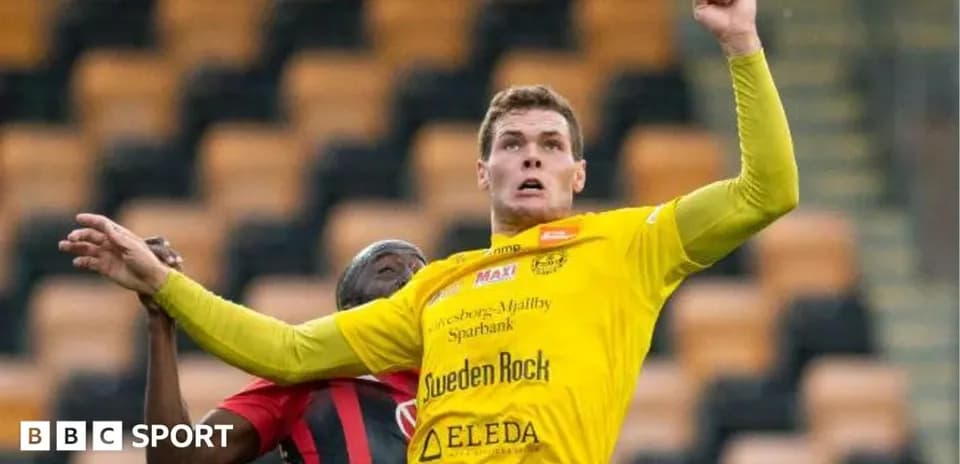 Player in yellow shirt contesting for the ball