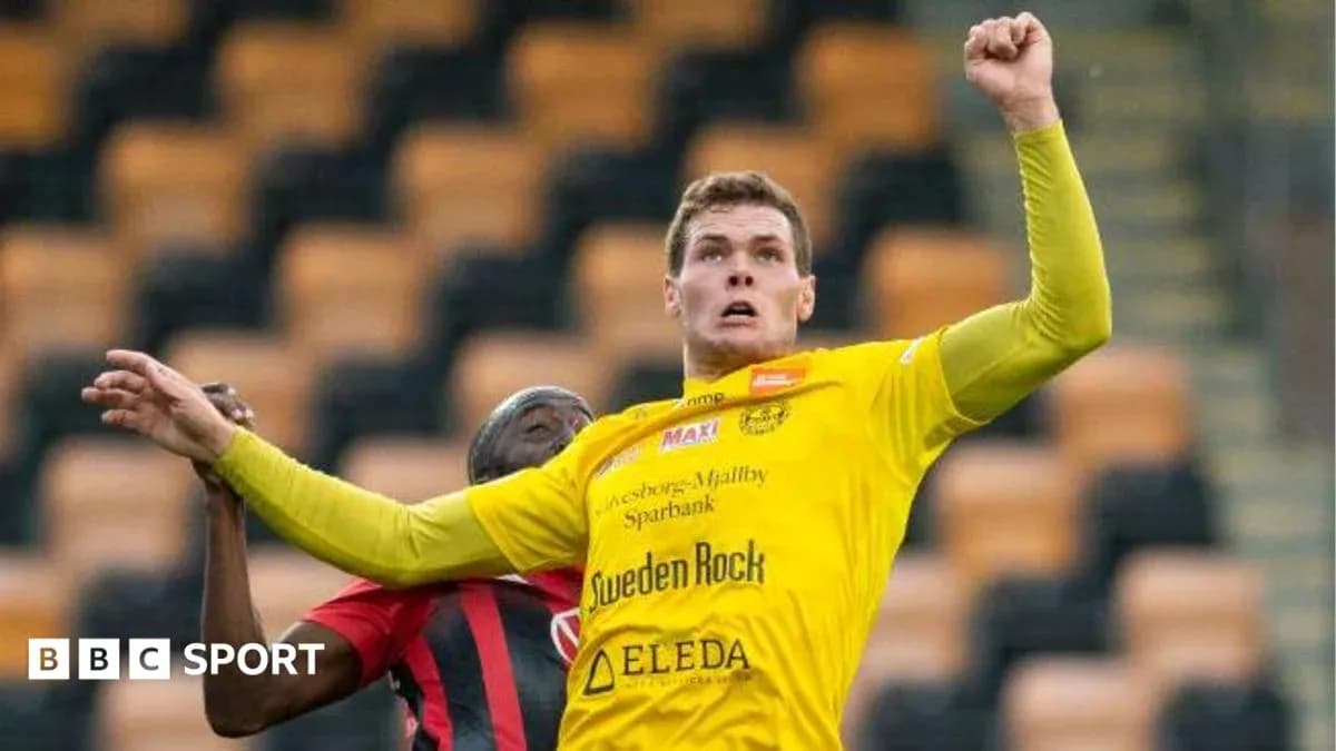Player in yellow shirt contesting for the ball