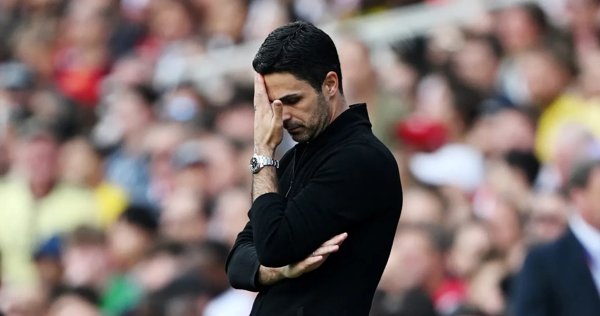 Manager looking concerned during match on sideline