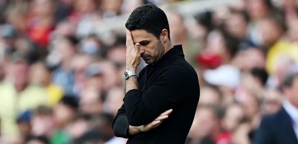 Manager looking concerned during match on sideline