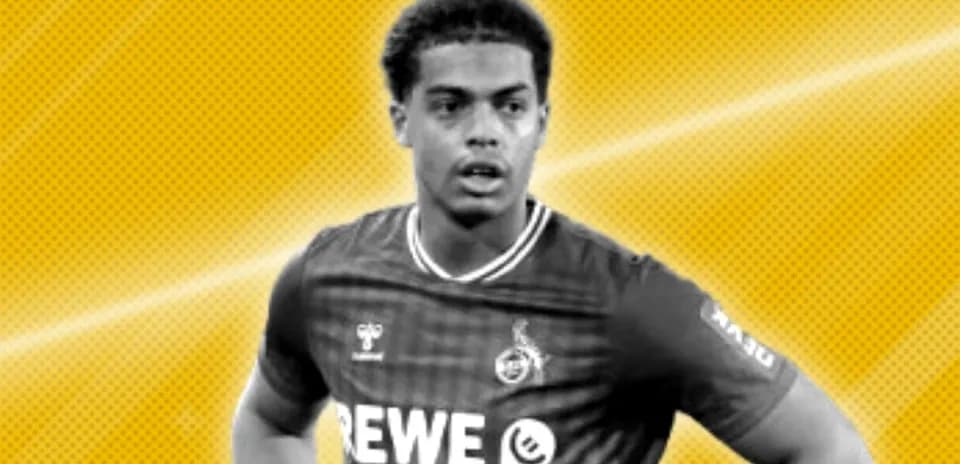 Football player in REWE jersey against yellow background