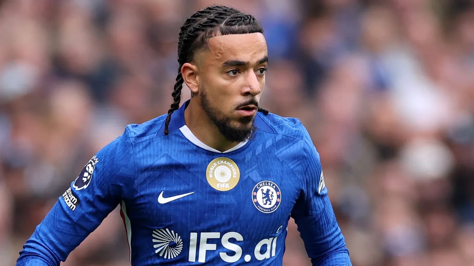 Chelsea player running with ball during match