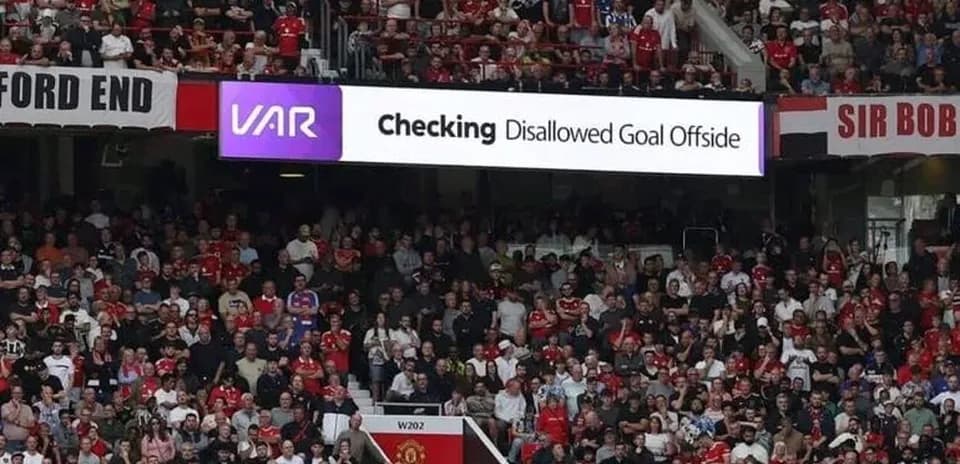 Crowd watching VAR decision for disallowed goal