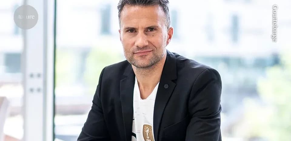 Man in a suit posing for a portrait indoors
