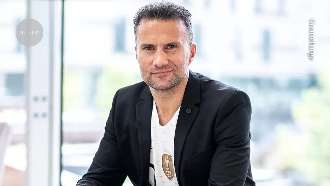 Man in a suit posing for a portrait indoors