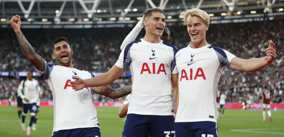 Tottenham players celebrating a goal on the pitch