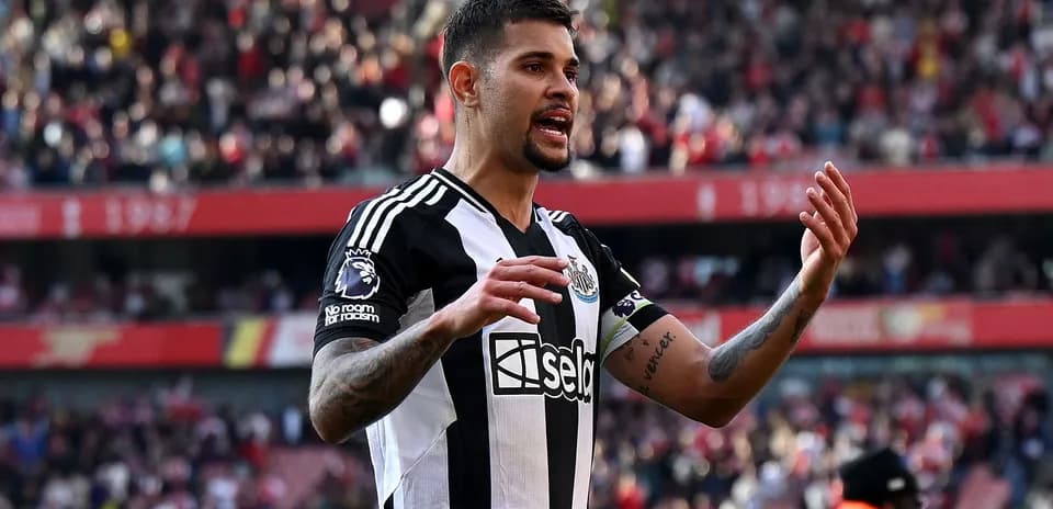 Newcastle player gesturing during match at stadium
