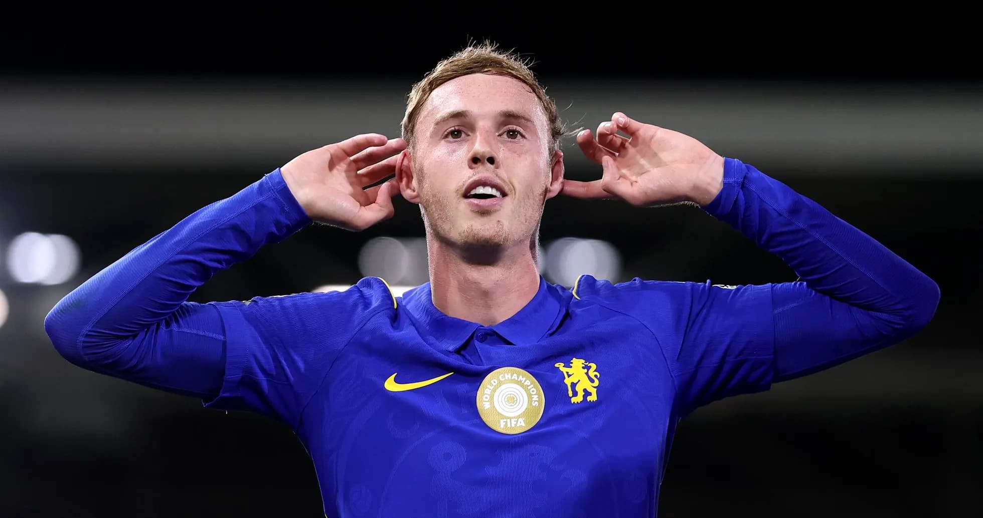 Player celebrating goal with hands to ears