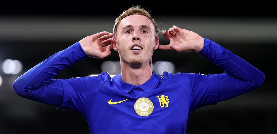 Player celebrating goal with hands to ears