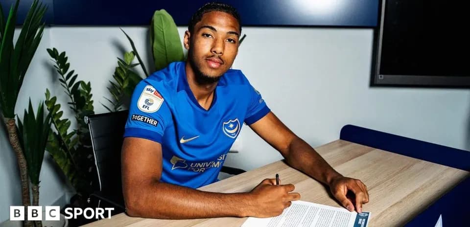 Player signing contract at club office