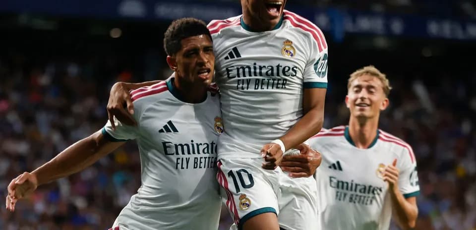 Real Madrid players celebrating a goal on field