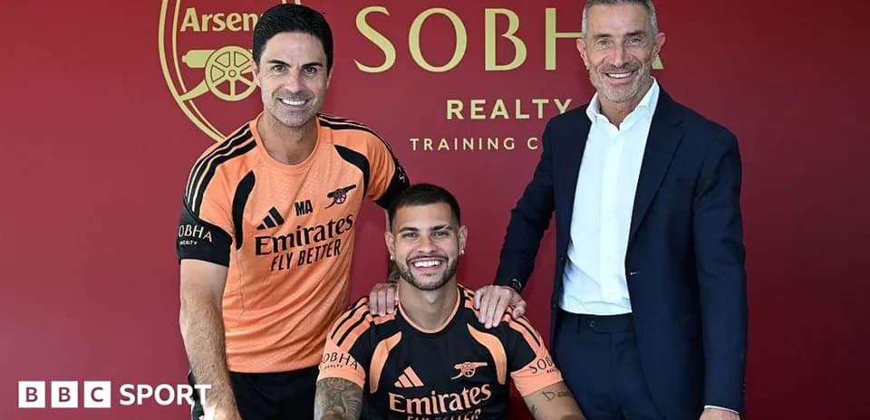 Manager and player posing at signing event