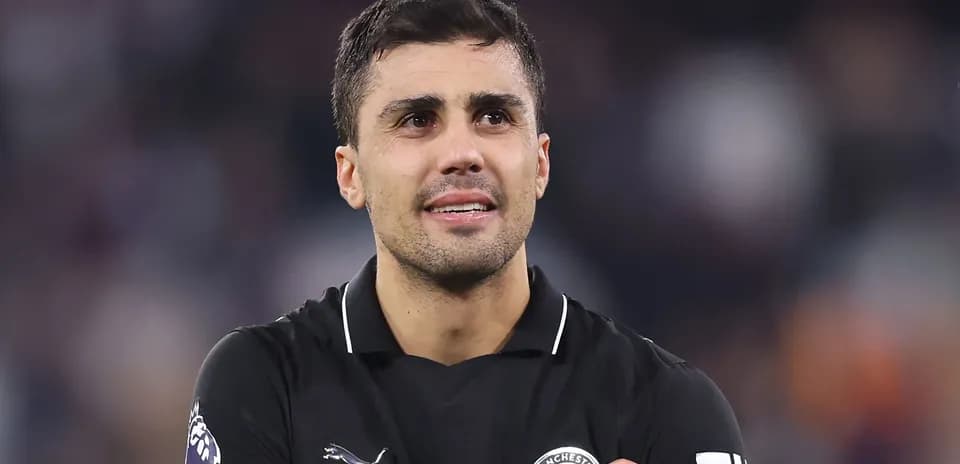 Player in black kit celebrating after match