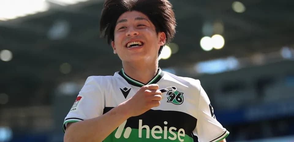 Player celebrating after scoring a goal on field