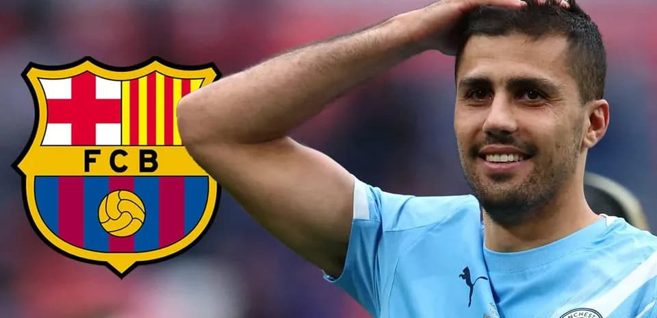 Player with Manchester City jersey and Barcelona logo