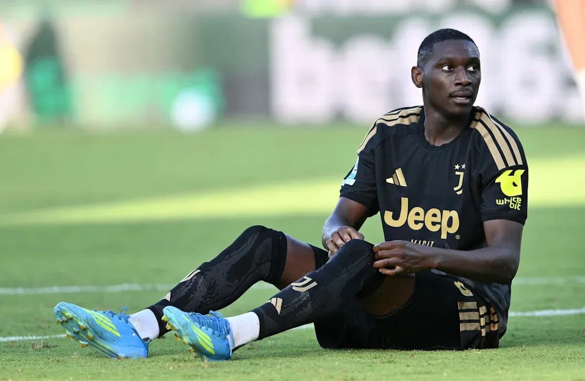 Juventus player sitting on the field during match
