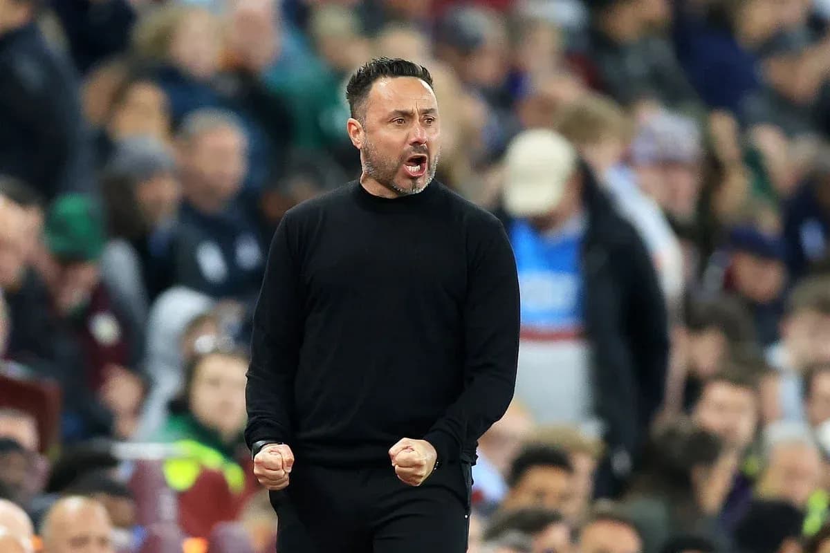 Coach celebrating during a match on the sidelines