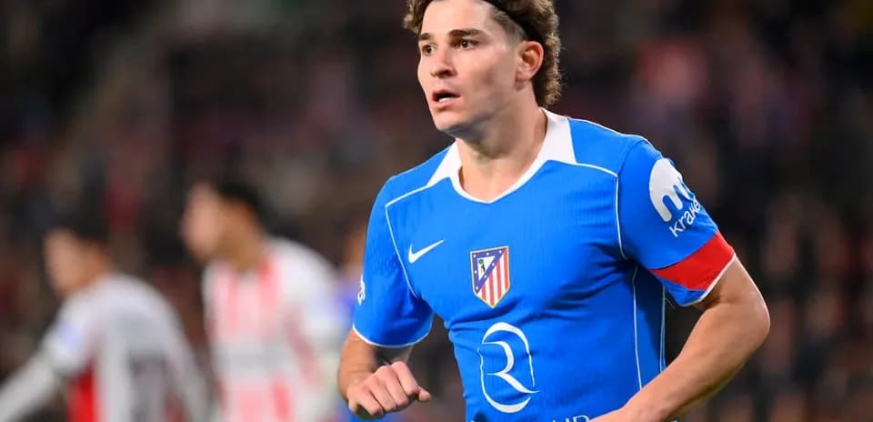Player in blue Atlético Madrid kit during match