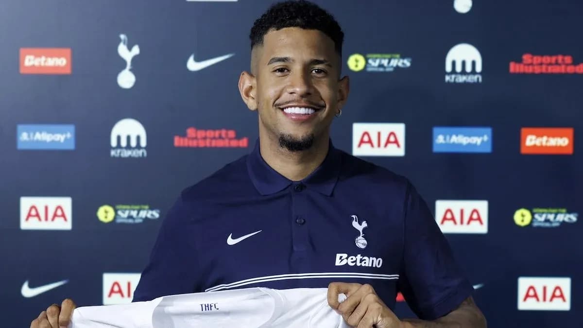 Player holding Tottenham Hotspur jersey at announcement