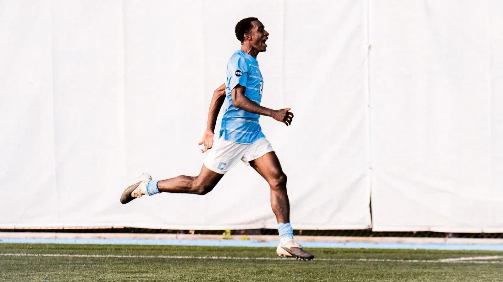 Player celebrating a goal on the field