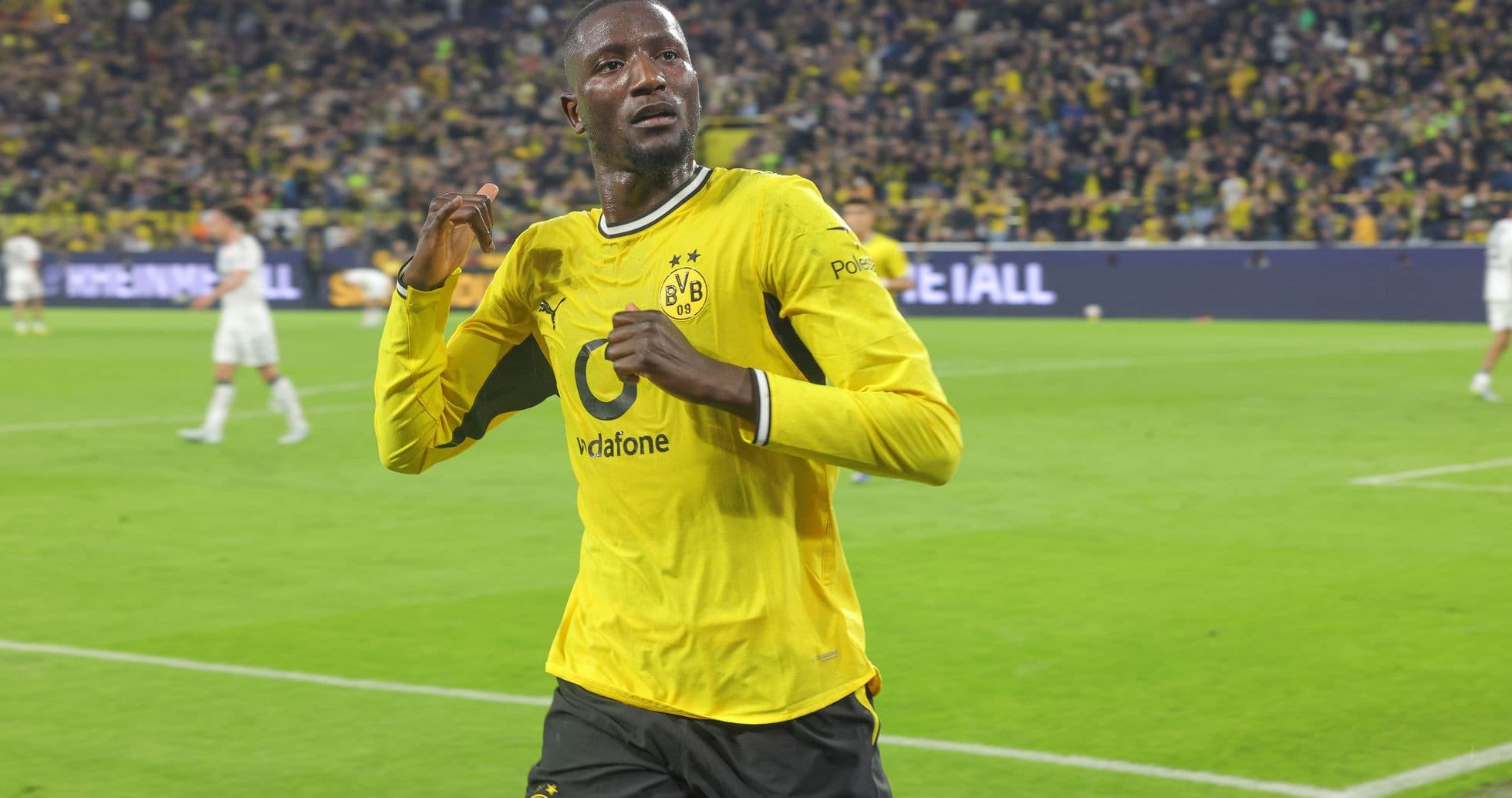 Player celebrating a goal in Borussia Dortmund jersey