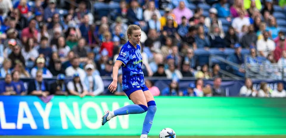Player kicking the ball during Seattle Reign FC match
