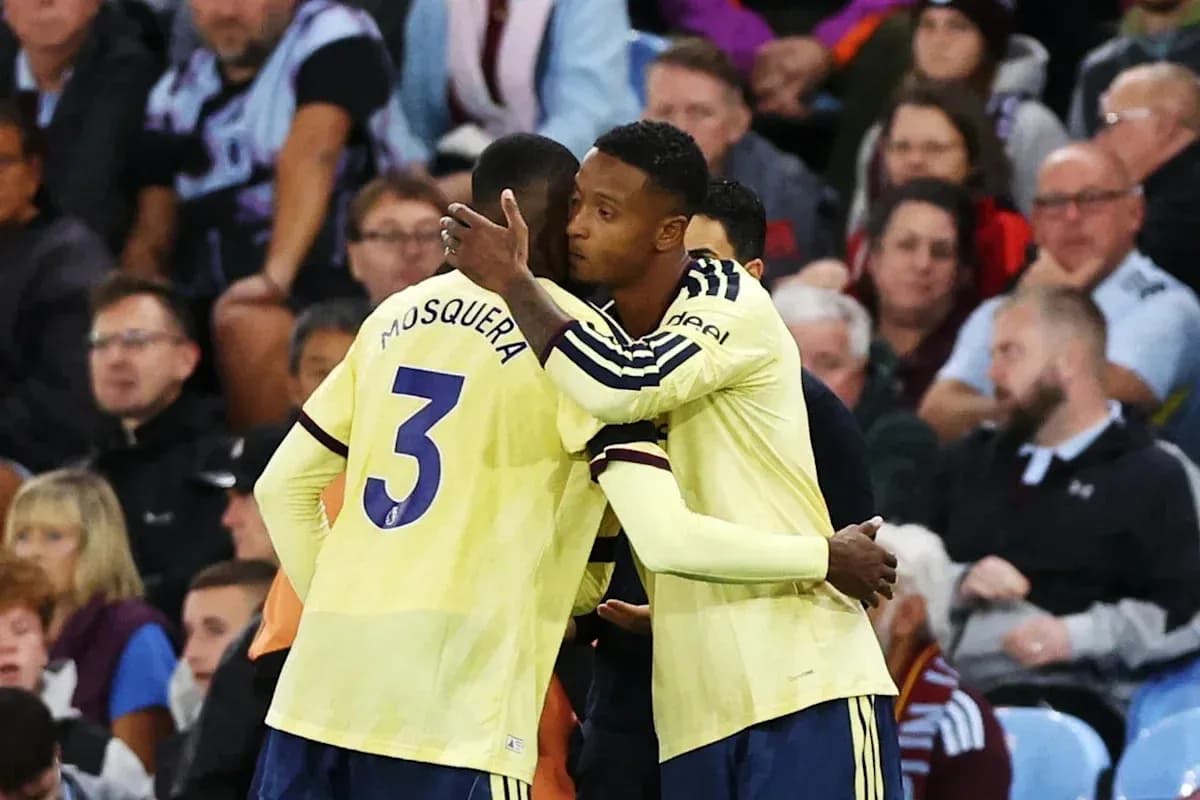 Players embracing on the sideline during match