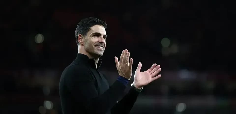 Manager applauding the crowd after the match