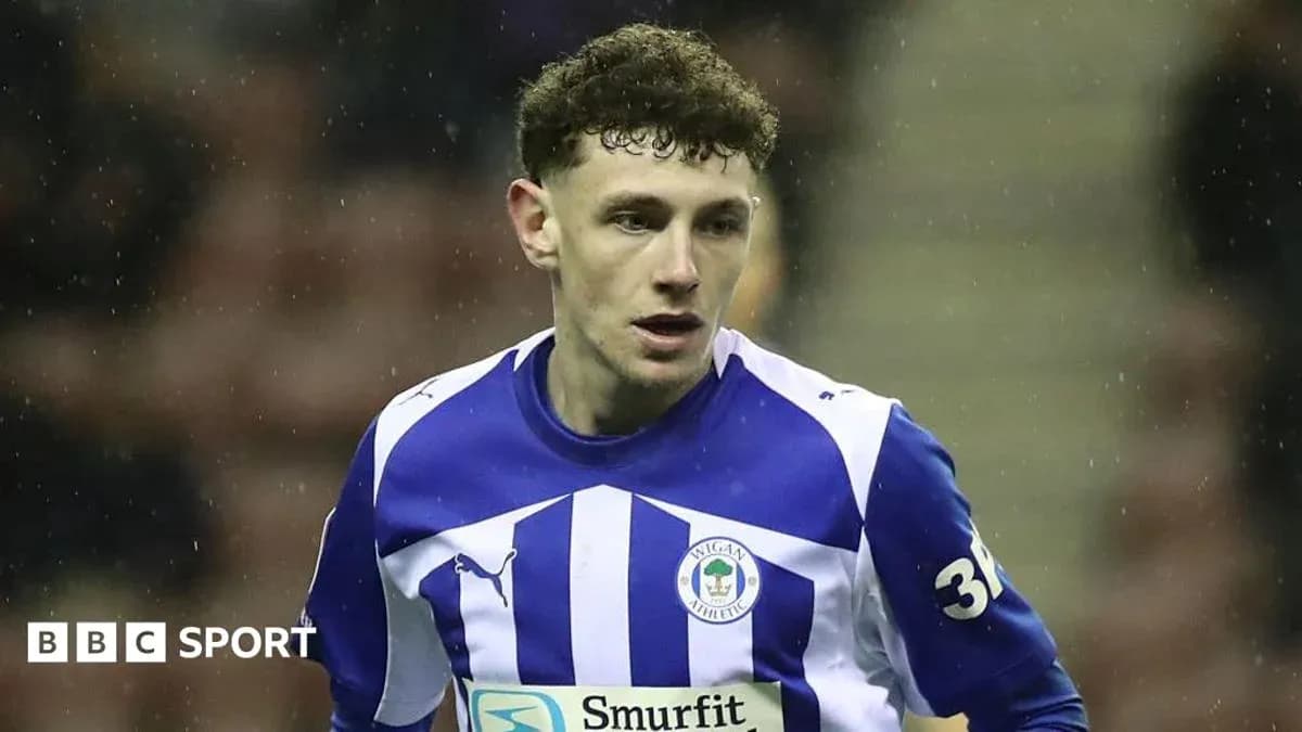 Wigan Athletic player in blue and white jersey